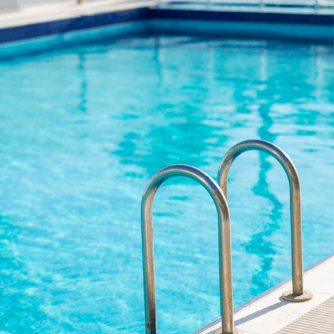 Swim in the shared rooftop pool to cool off in the Spanish heat