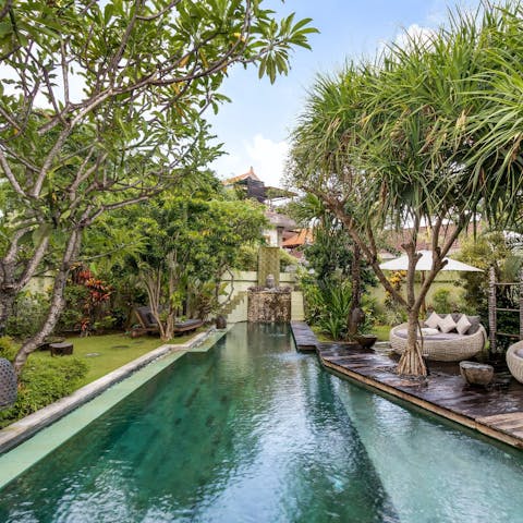 Do your morning lanes in the large private pool amid the green vegetation