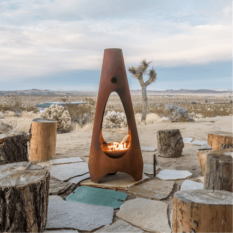 Gather round the striking outdoor fireplace