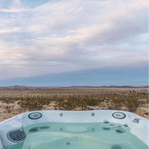 Unwind in the hot tub with desert views