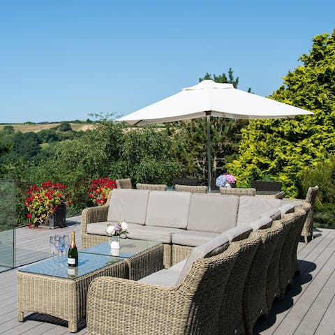 Enjoy views of the countryside and sea from the deck
