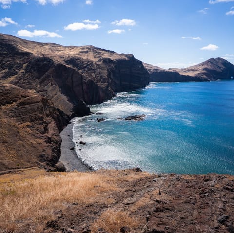 Explore the incredible volcanic black sand beaches