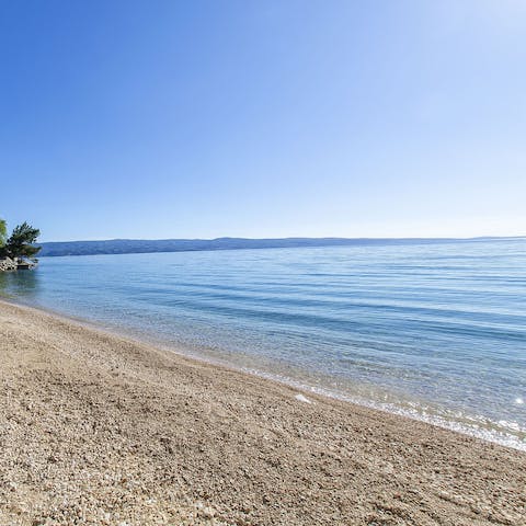 Stroll right down to the pebbly beach in less than a minute