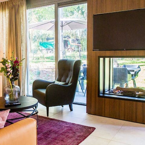 Light up the contemporary fireplace and watch the flames through the glass