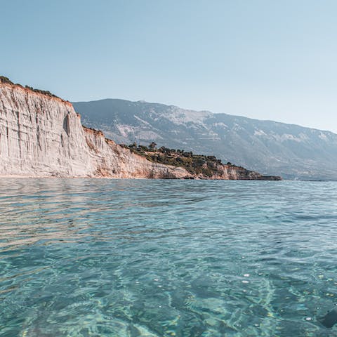 Dive into the crystal waters off Agios Thomas Beach, a short drive away