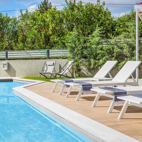 Stretch out poolside to soak up the Mediterranean rays