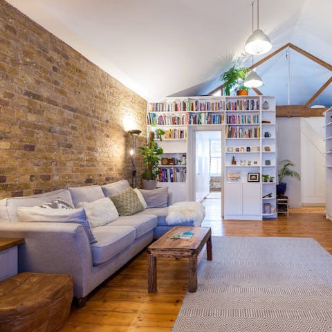 Kick back on the sofa with a glass of wine and one of the books on the shelves