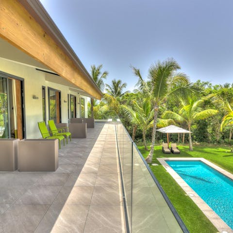 Start each day on this wraparound balcony, overlooking your pool and trampoline