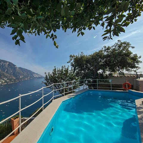 Enjoy a refreshing dip in the pool, complete with sea views