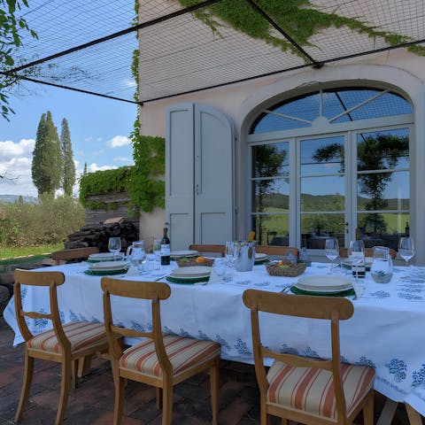 Gather around the dining table for a dinner of wine and pasta