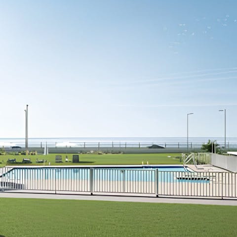 Admire sea views from the communal salt-water swimming pool
