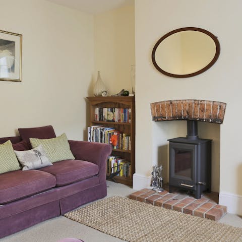 Cosy up next to the wood burner on chilly evenings