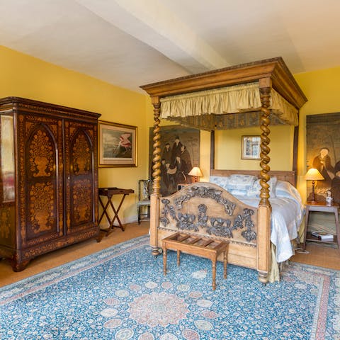 Fall asleep in an antique four-poster bed
