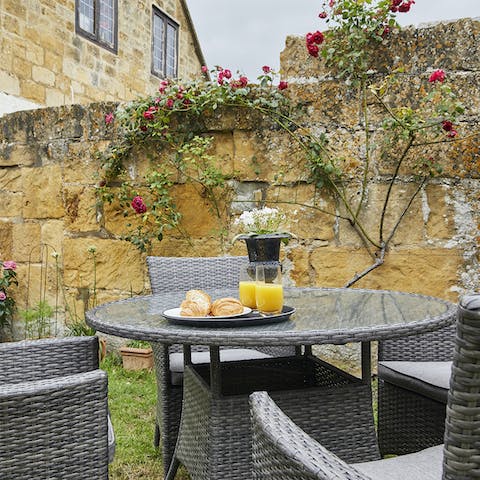 Enjoy an afresco breakfast every morning in the charming walled garden