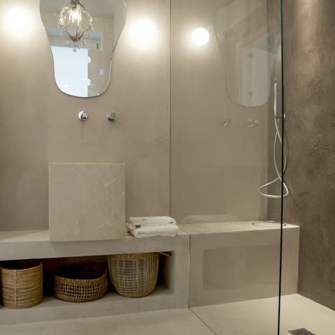 Pamper yourself in the limestone bathroom ahead of a night out on the town