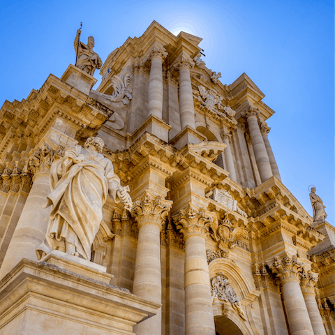 Visit the magnificent Cathedral of Syracuse, an eight-minute walk away