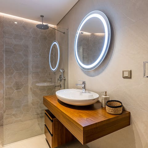 Unwind beneath the luxurious rainfall shower ahead of a busy day of exploring