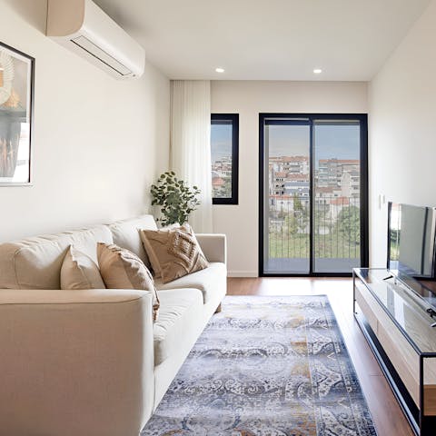 Enjoy a glass of Portuguese wine in the bright living area