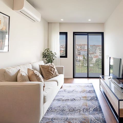 Enjoy a glass of Portuguese wine in the bright living area