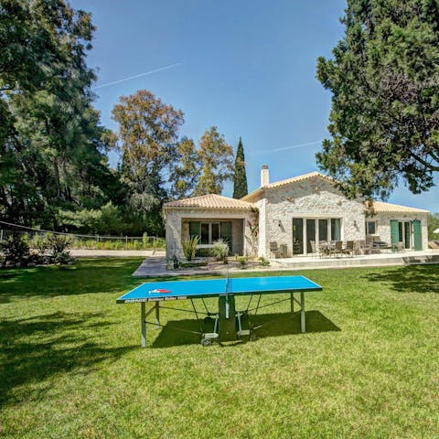 Challenge your guests to a game of table tennis on the lawn