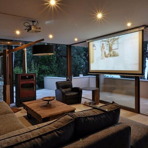Snuggle up with a blockbuster film in the cosy cinema room