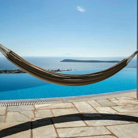 Swing in the hammock looking out at the islands floating on the ocean