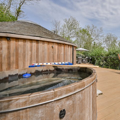 Take a dip in the cedar wood-fired hot tub