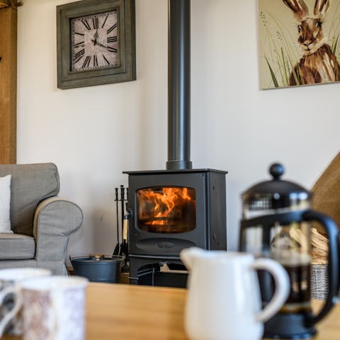 Put another log on the toasty fire and snuggle up in the cosy living area