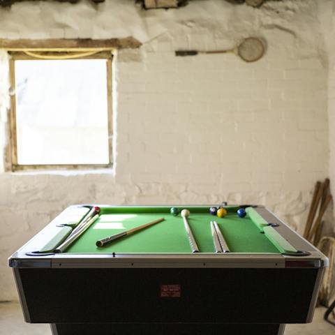 Play ball games whatever the weather – shooting pool is a great way to while away a few hours