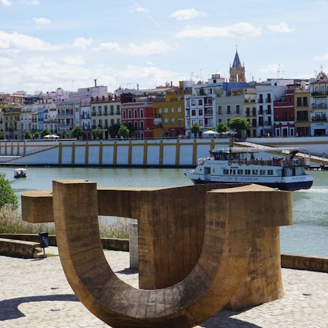 Enjoy a late afternoon stroll along the Guadalquivir River