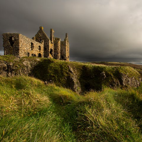 Visit the Dunskey Castle, a twenty-minute walk up the Scottish coastline