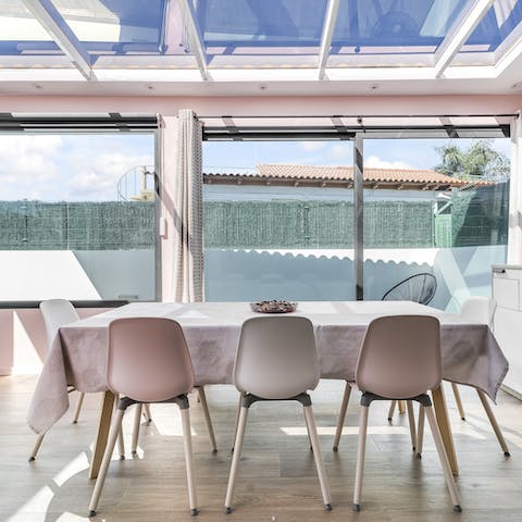 Enjoy a sun-soaked breakfast in the conservatory-like dining area