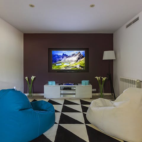 Cosy up for film night in the modernist media room