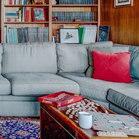 Take your pick from a selection of board games in the cosy living room