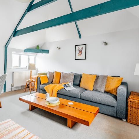 Admire the funky, blue painted beams in the living room