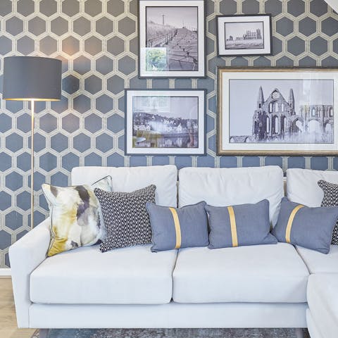 Admire the depictions of local landmarks in the stylish living space