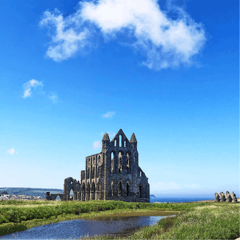 Explore the Gothic ruins of Whitby Abbey, a fifteen-minute walk away