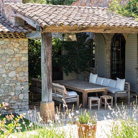 Dine alfresco under the shaded pergola