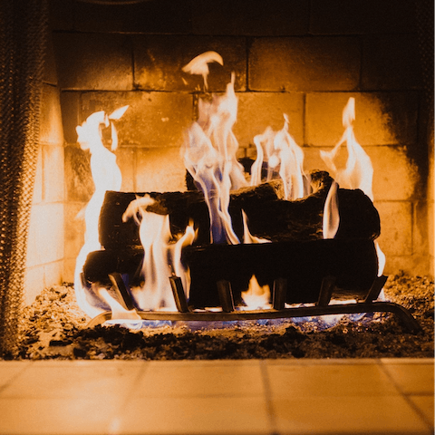 Stay warm by the home's feature fireplace