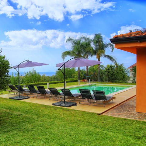 Soak up the Sicilian sunshine by the private pool