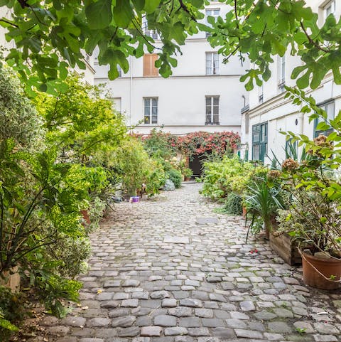 Bring out a chair and sit in the plant-filled courtyard for a quiet moment