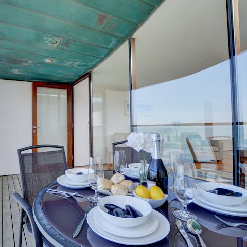 Dine on local seafood on the balcony