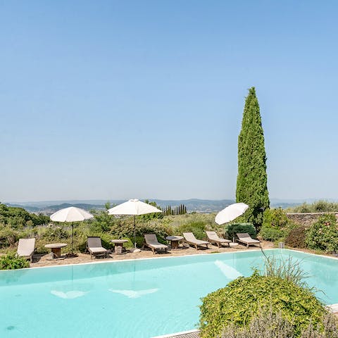 Stretch out poolside with your new book in the Tuscan sun