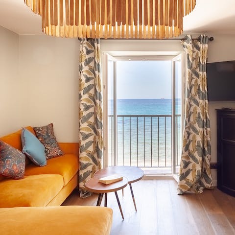 Take in glistening sea views from the living room window