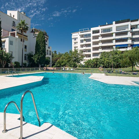 Dive into one of the two communal swimming pools