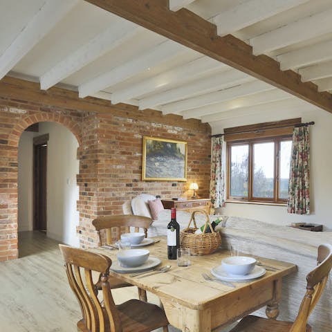 Admire the original architectural features of the barn, such as brickwork and beams