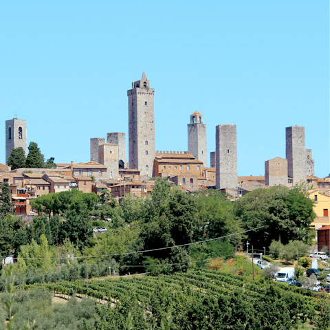 Spend a day strolling the atmospheric streets of San Gimignano – just 20km away