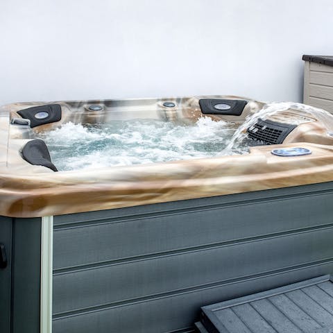 Sink into the outdoor hot tub for a long, luxurious soak