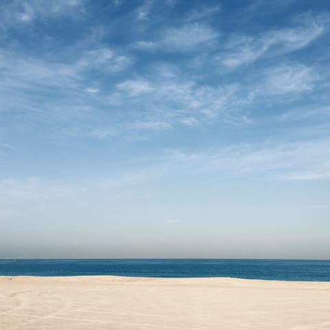 Cool off with a dip in the Persian Gulf at Marina Beach, a short walk away