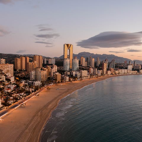 Stroll along Poniente Beach into the heart of Benidorm